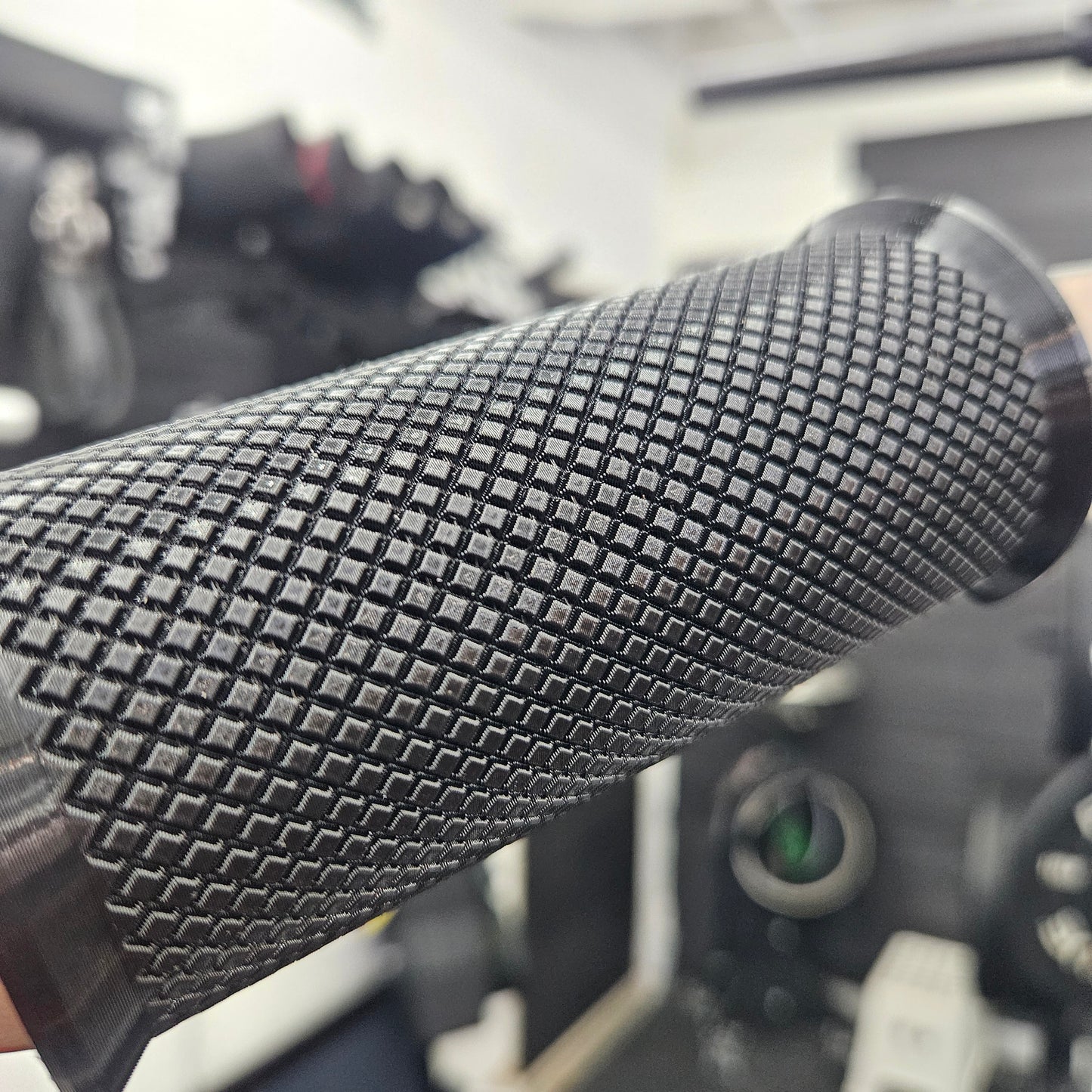 Close-up of 2-inch thick D-Grip handle showing textured TPU material and mounting hardware