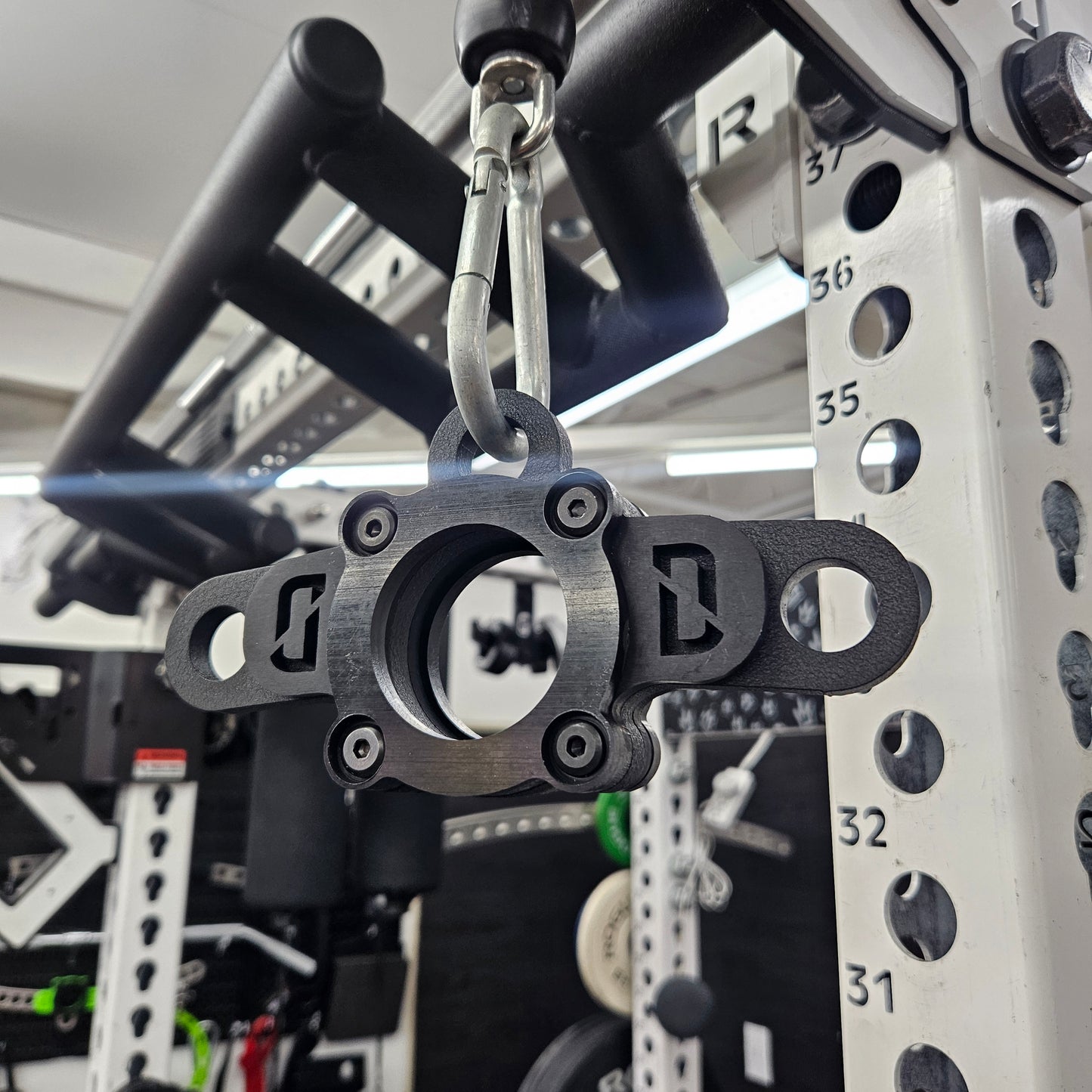 Side profile of the Tiny Bar highlighting black acetal barbell liner and heavy-duty construction