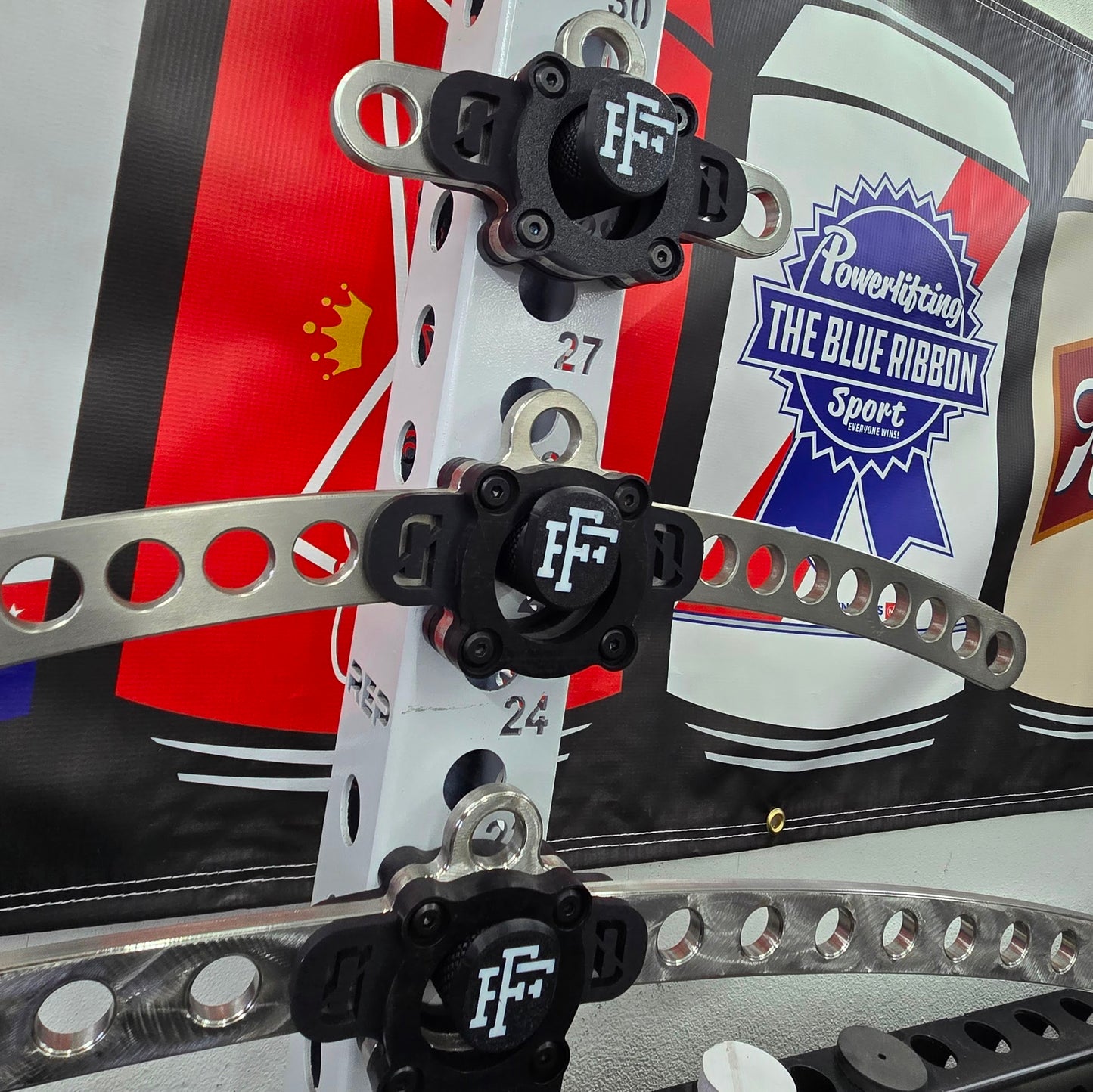 FrogFits Bar Holder mounted on a 5/8-inch power rack