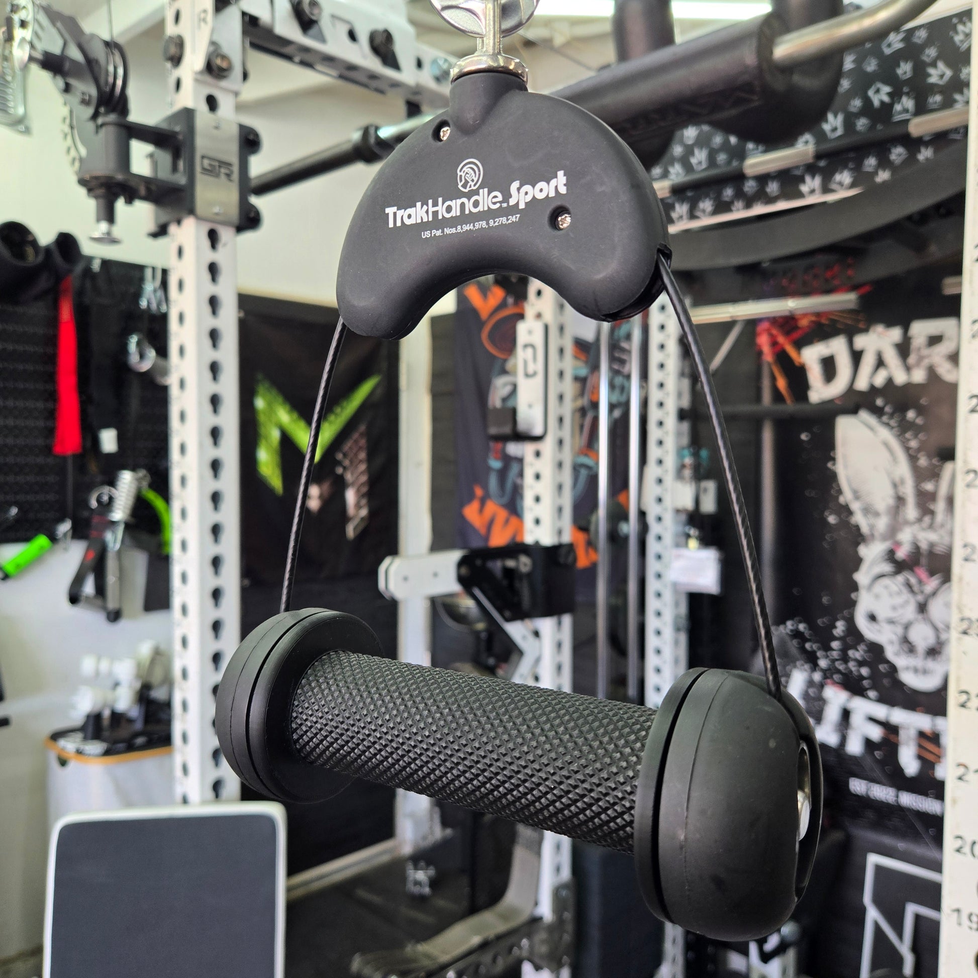 Close-up of a black throttle grip and control on a mechanical background