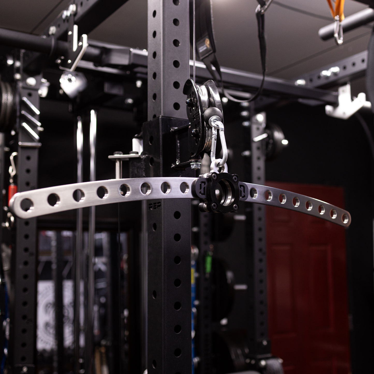The Longy Bar mounted on cable system, demonstrating landmine row setup capability