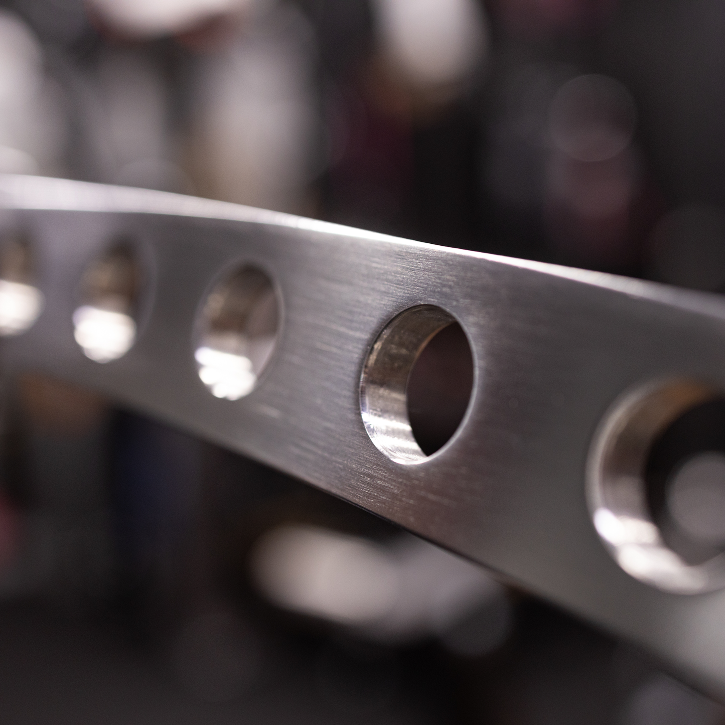 Close-up of chamfered holes on The Longy Bar for smooth grip placement