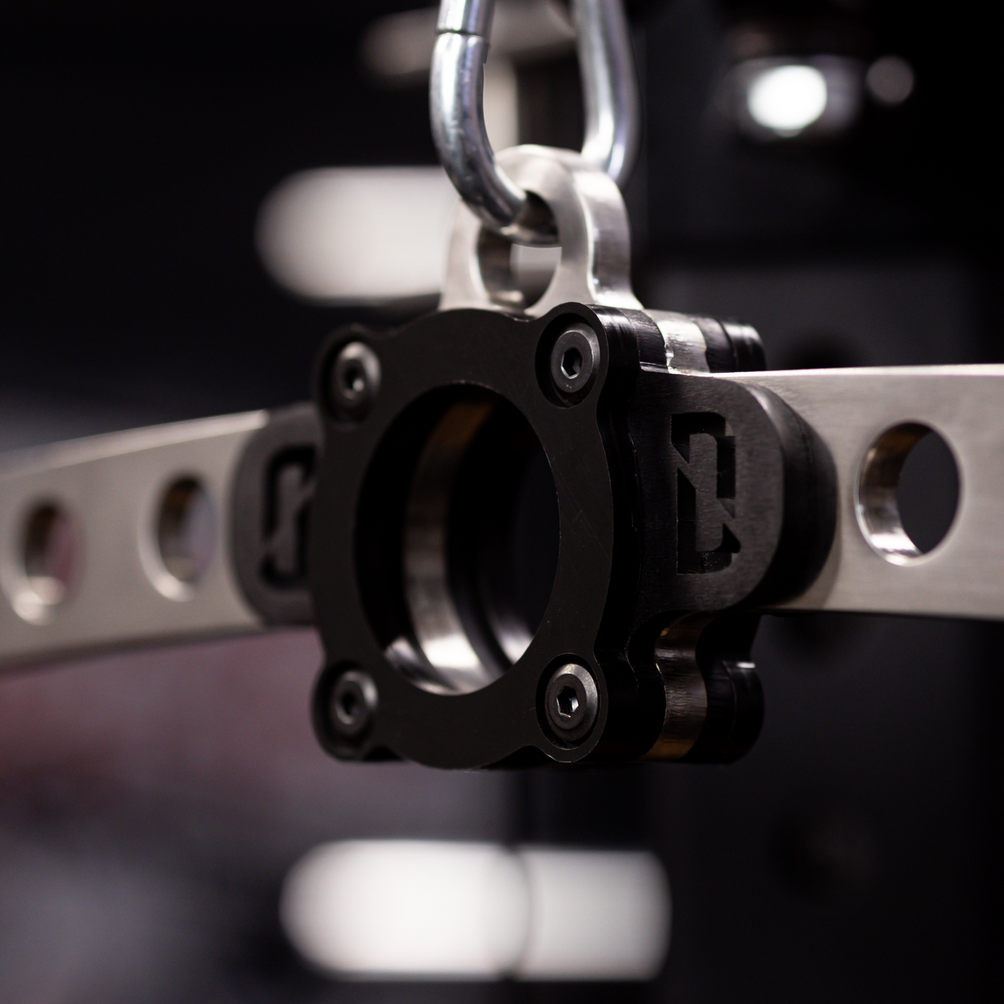 Overhead/front view of The Longy Bar showing dual hole spacing (24 in & 10.4 in) for variable grip