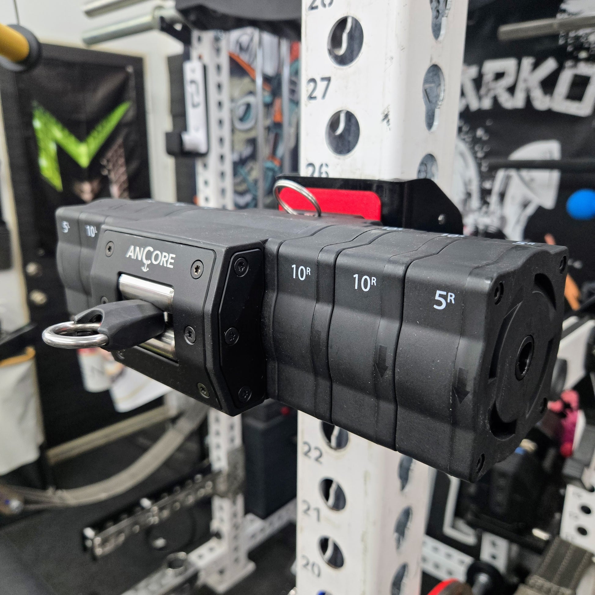 Black weightlifting attachment on a rack 
